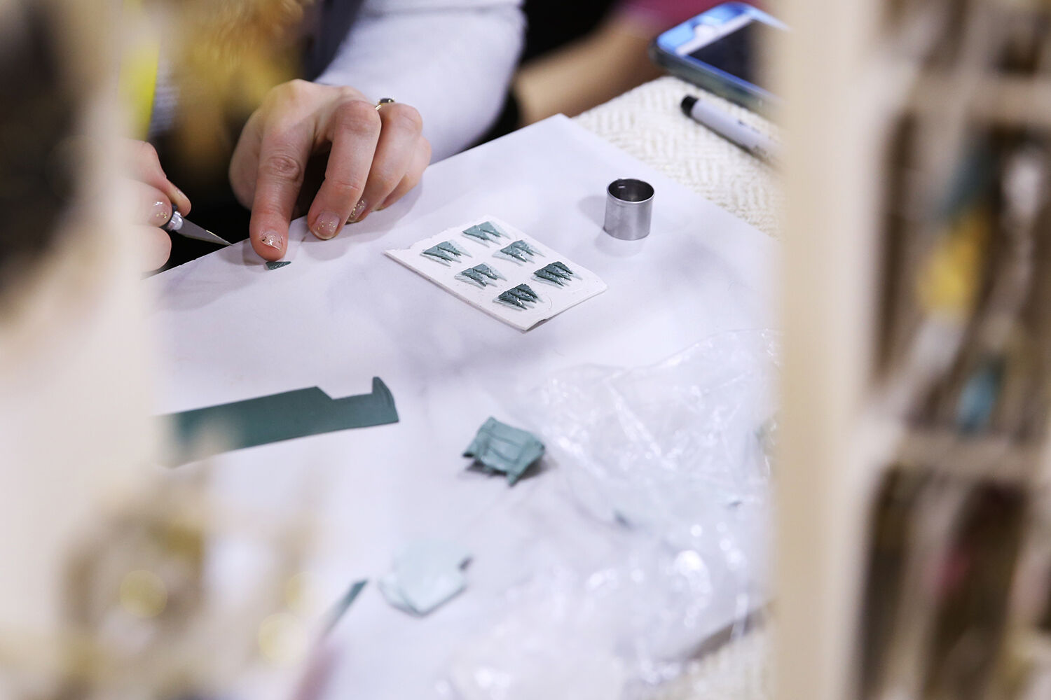 Christie Brazer creates new earings at the show